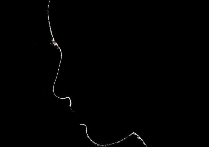 Student Services - Silhouette of person looking down.